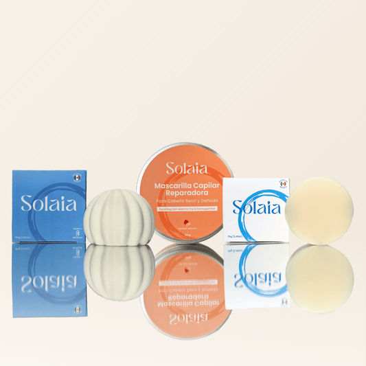 Trio capilar esencial Solaia con shampoo solido, acondicionador solido y mascarilla capilar reparadora en lata, junto a sus empaques